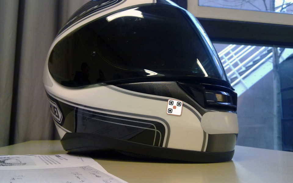 Helmet placement advisory with VaahanSafe QR decal