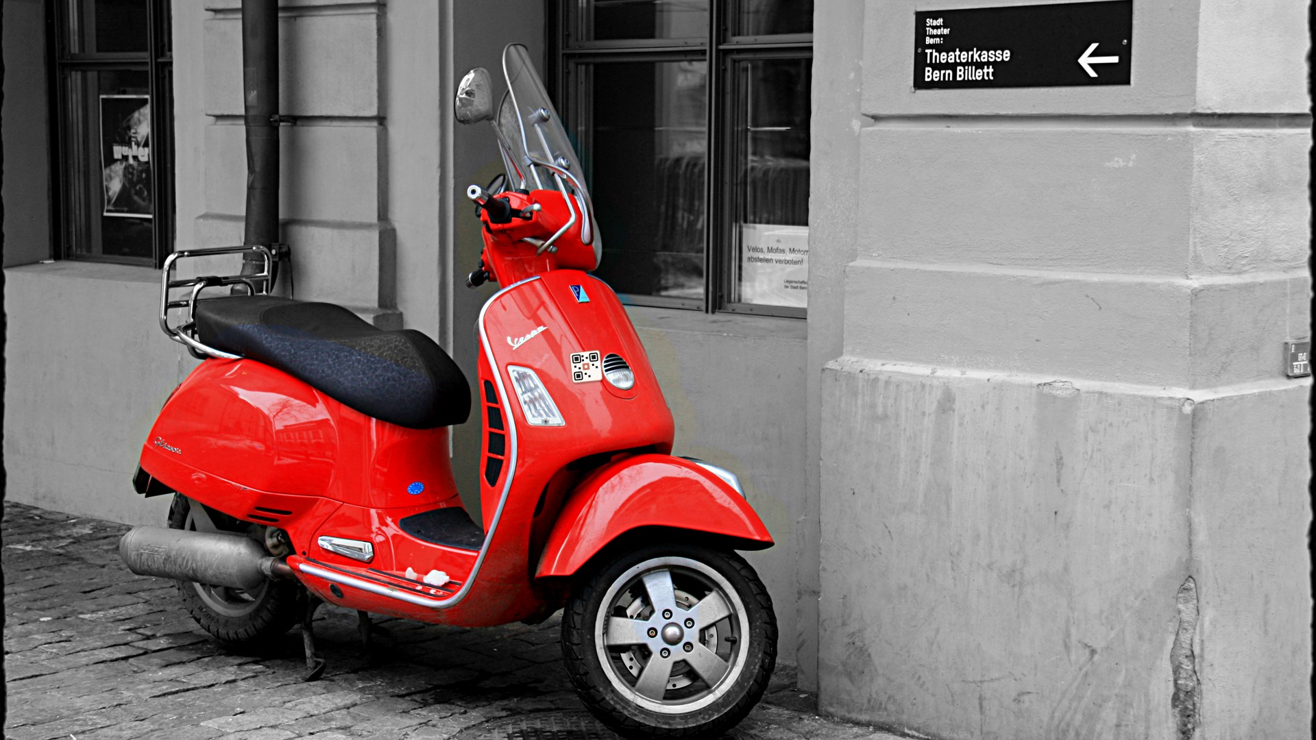 Scooter placement photograph with VaahanSafe QR safety decal on front apron legshield